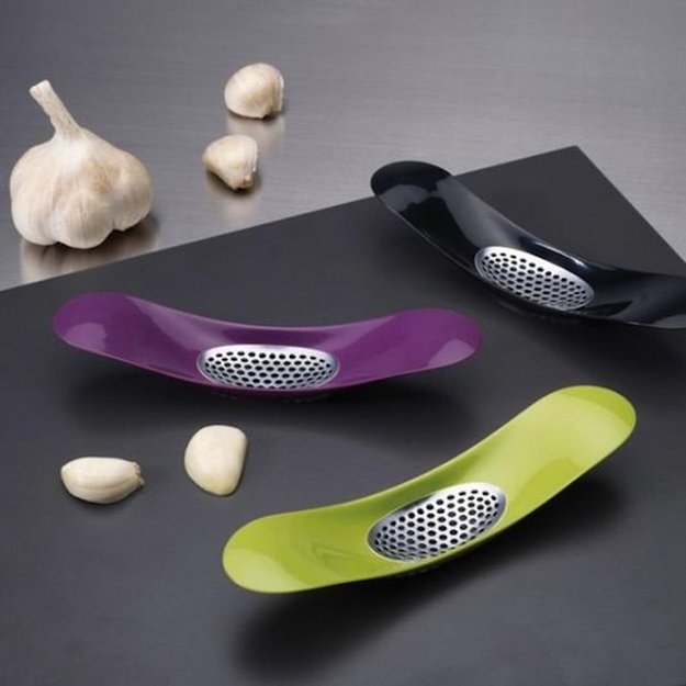 Small and Colorful Garlic Crusher | Homemade Recipes http://homemaderecipes.com/cooking-101/25-must-have-kitchen-utensils