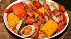 cajun style seafood boil on serving | New England Clam Bake Recipe | Homemade Recipes | featured