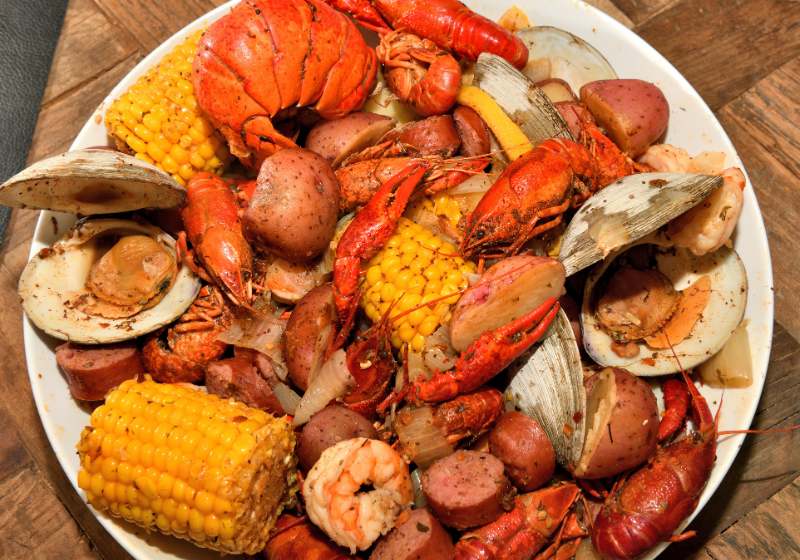 cajun style seafood boil on serving | clam boil recipe
