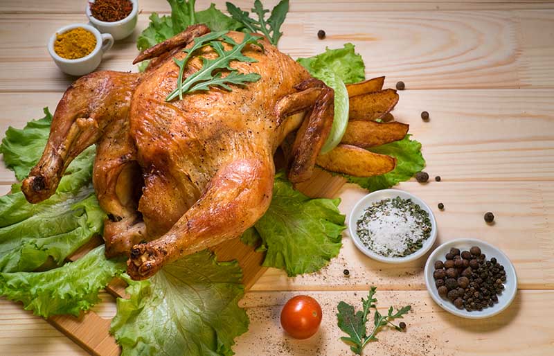 fried turkey on wooden board | tips for deep frying turkey