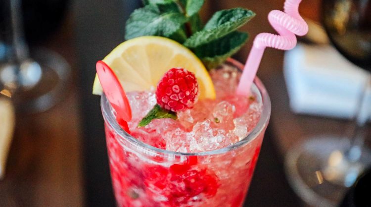 raspberry cold beverage with sliced lemon and mint-non-alcoholic cocktails-px-feature