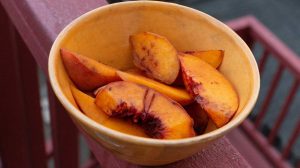 PqJdWBRD-4w-peach slices in a bowl-Peach Melba-us-feature