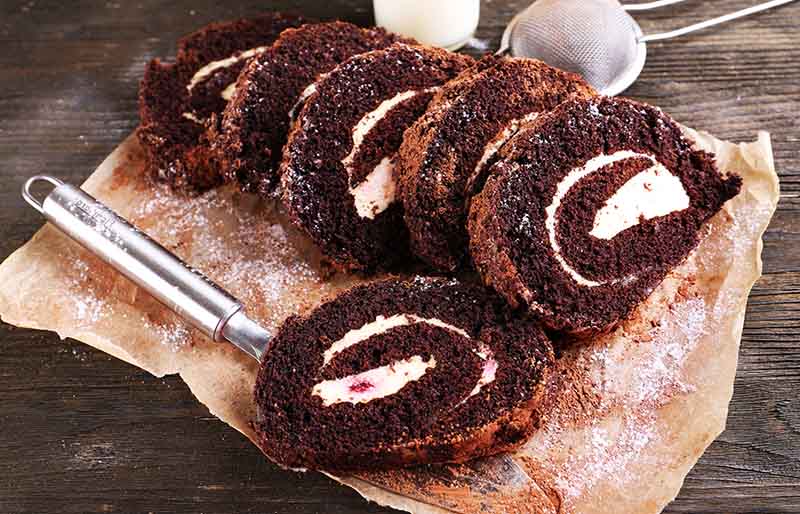 delicious chocolate roll on parchment closeup | winter cake flavors