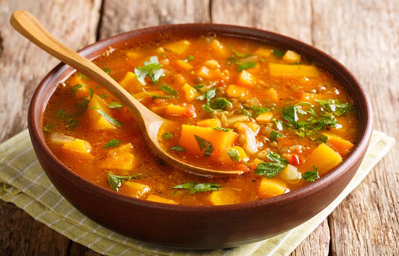 serving homemade sweet potato lentil soup | winter dinner menu