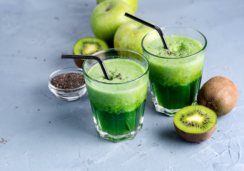two glasses healthy green kiwi apple | healthy juices