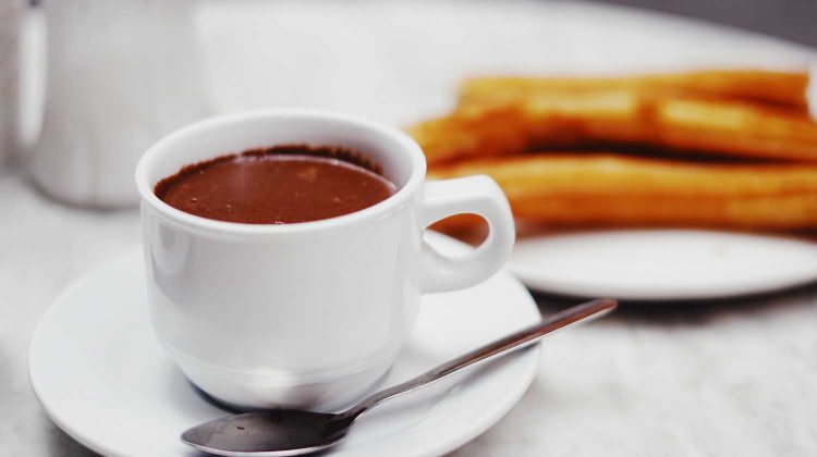 5CPn8_NE2Tc-cup of chocolate drink with plate of churros-breakfast recipes-us-feature
