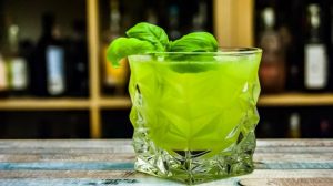Rock glass filled with green liquid | Green St Patrick’s Day Drink Recipes You Must Try | Featured