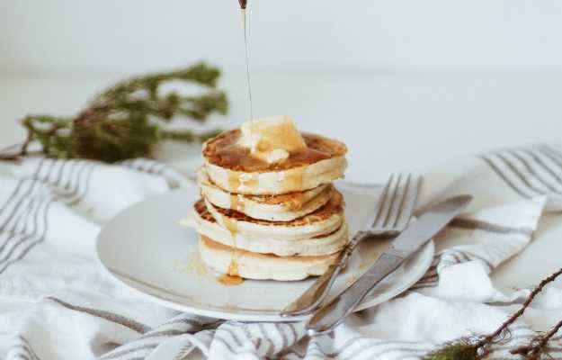 person pouring honey on top of pancake-Healthy Banana Pancake Recipe-us