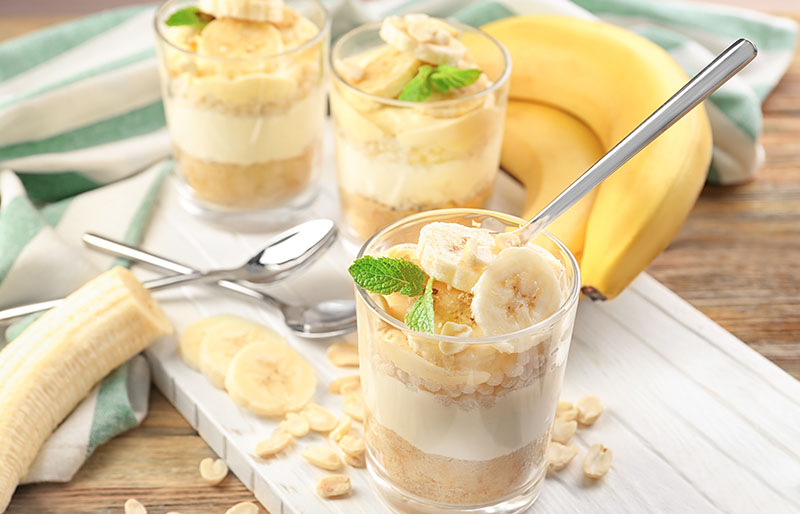 glasses delicious banana pudding on wooden | soul food dinner menu
