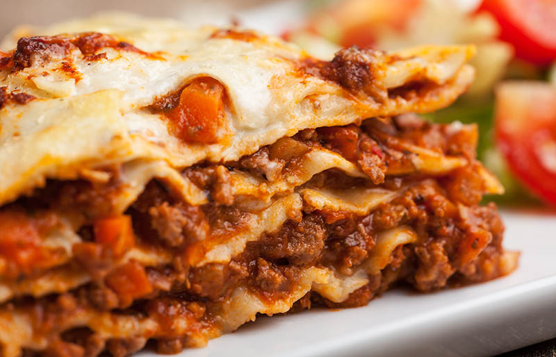 lasagna on square plate | soul food dinner menu
