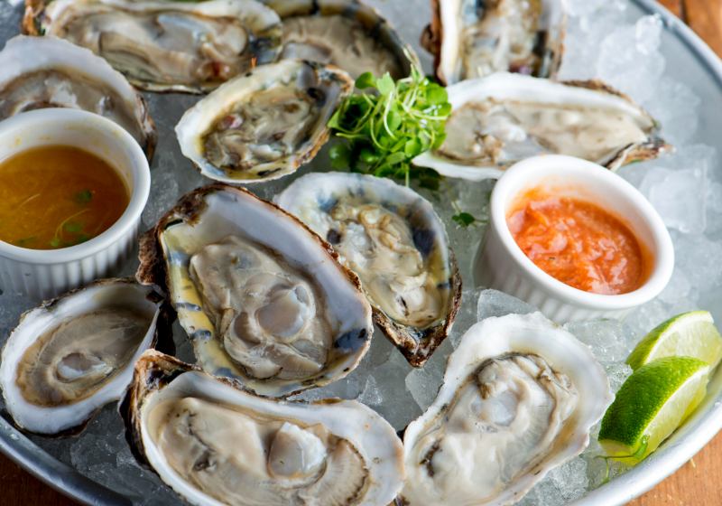 oysters on half shell fresh served | romantic table setting for two at home