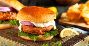 Homemade Salmon Burger with Tartar Sauce and Onion | Flavorful Canned Salmon Recipes That You’ll Surely Love | recipes for canned salmon | featured