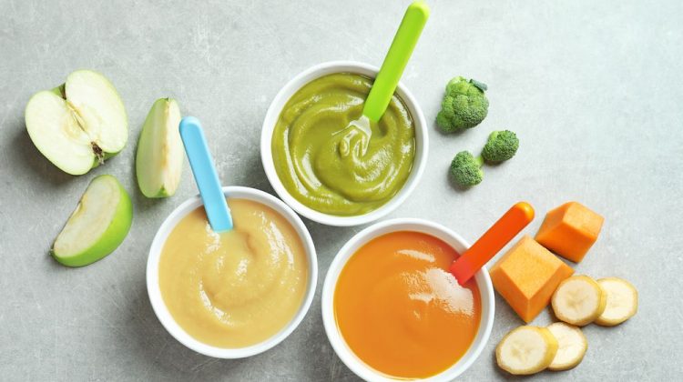 Bowls with baby food on grey background | Healthy Homemade Baby Food Recipes | featured