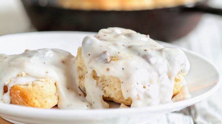 American biscuits from scratch covered with thick white sausage gravy | Creamy Homemade Country Gravy | featured