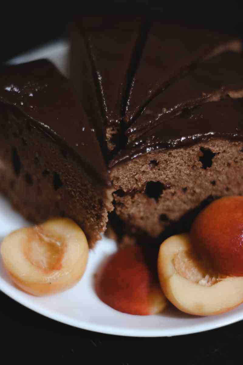 brown cake with sliced lemon on white ceramic plate | Easy gluten free cheesecake