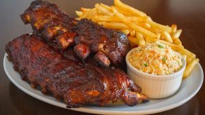 pork ribs back french fries coleslaw | 13 Labor Day Recipes You Can Cook To Celebrate The Holiday