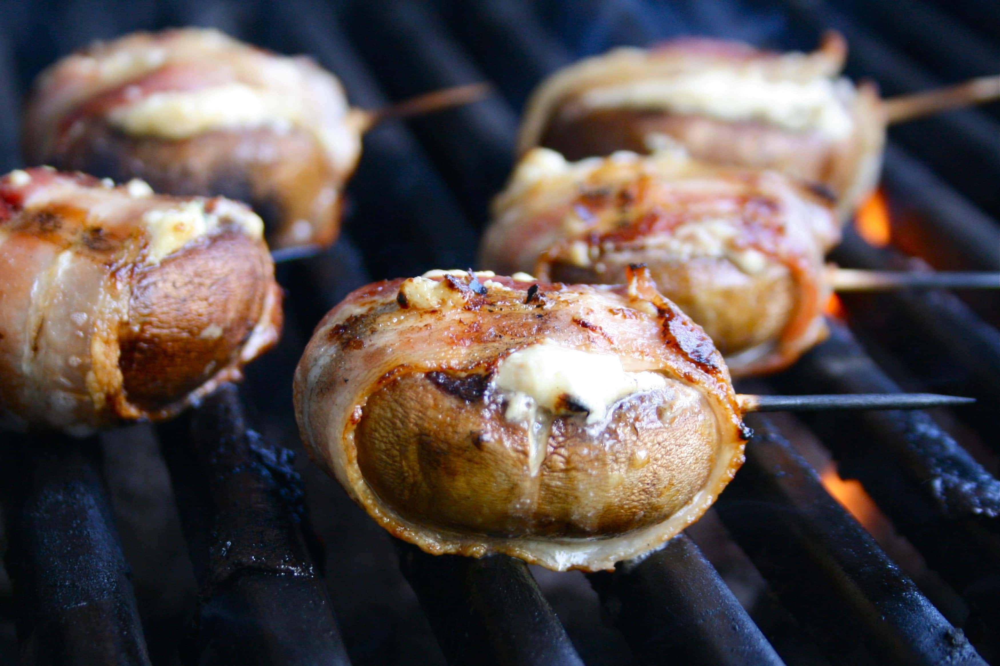 Blue Cheese Filled Bacon-Wrapped Mushrooms | https://homemaderecipes.com/bbq-grill/10-campfire-recipes/