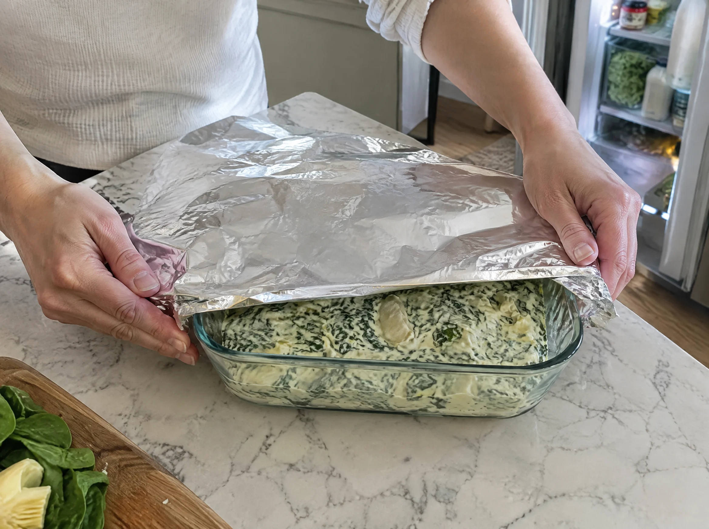 Covering an unbaked dip with foil the day before a Christmas party